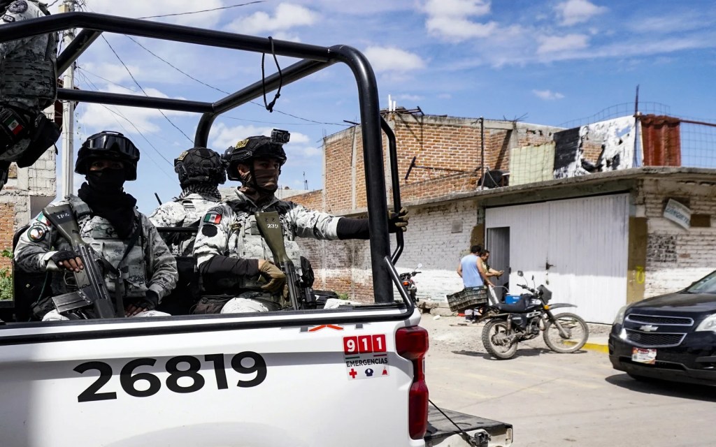 Mexican national guard in the back of their truck 