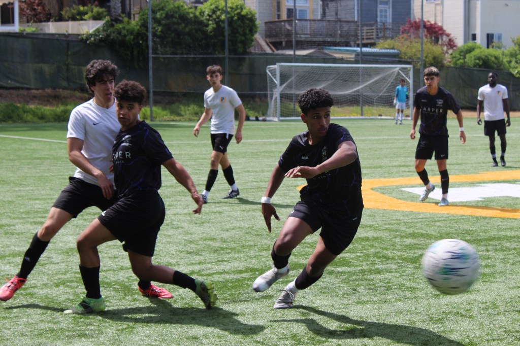 Victor Medrano is about to kick the incoming ball while Mohammed Mahdee is blocking the USF player at Negoesco Stadium on Saturday, April 5, 2025 